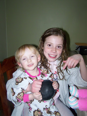 Two of my girls holding a still damp bowl from the dishwasher. The youngest is just happy but the older of the two is smiling because the bowl is clean and NOT greasy! To her, this means Mom will stop making them hand wash all of the dishes!