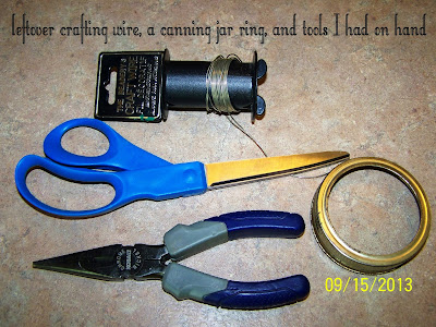 I had leftover crafting wire from a Christmas project that I used to craft the top of my wind chime.  A canning jar ring made a fine hoop to attach the strands of buttons to.